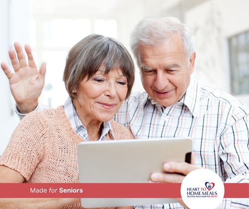 grandmother and grandfather talking to someone on their tablet