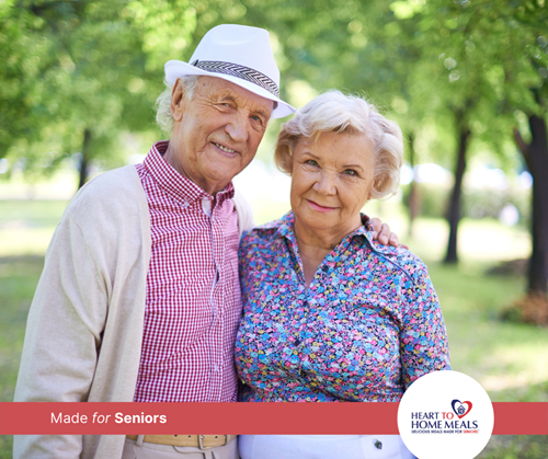 senior couple standing outside smiling on a beautiful sunny day