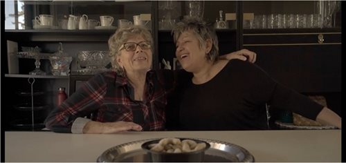 senior lady with her daughter smiling and laughing