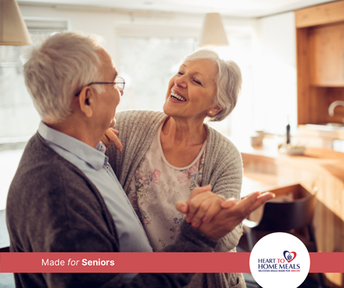 Senior couple dancing and smiling